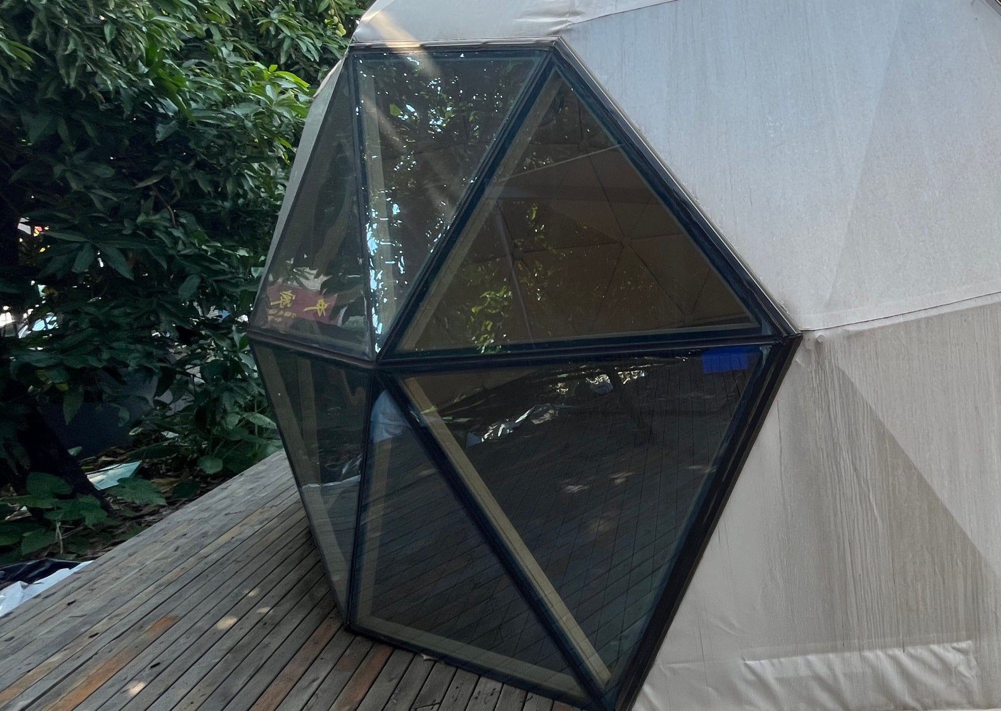 exterior of panoramic all glass dome tent window