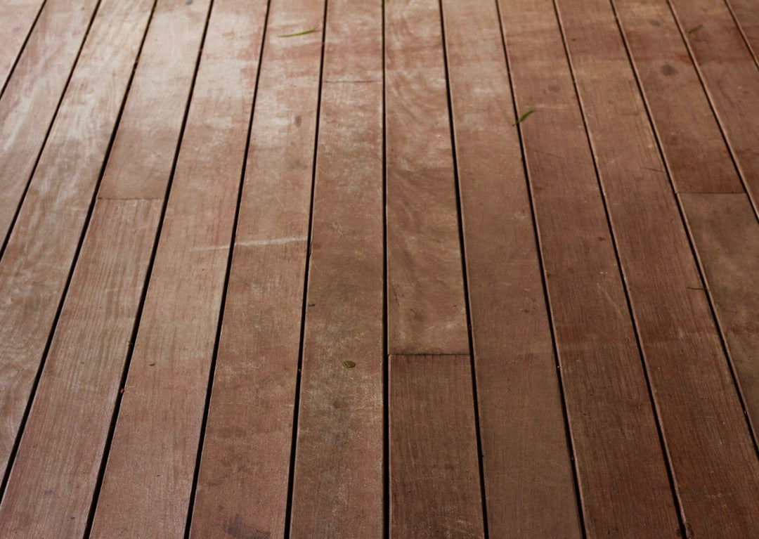 A close-up view of a wooden deck surface, illustrating the type of timber construction, recommended by Glamping Dome Store, for a stable geodesic dome foundation.